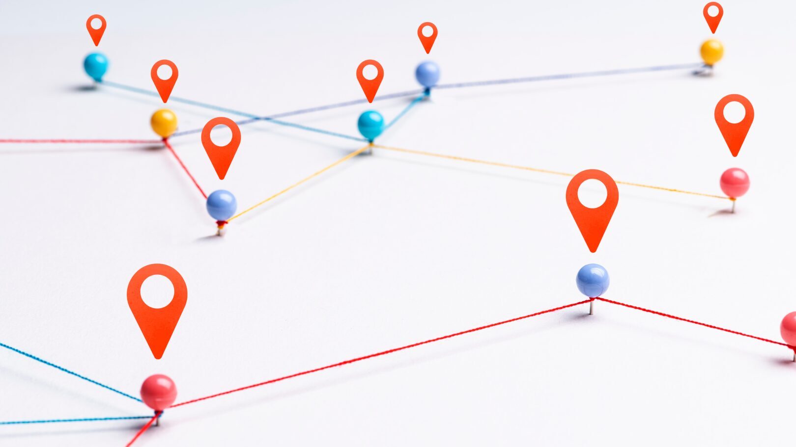 Colorful location pins connected by strings on a map, representing field sales network and connectivity, with RepMove logo in the corner.